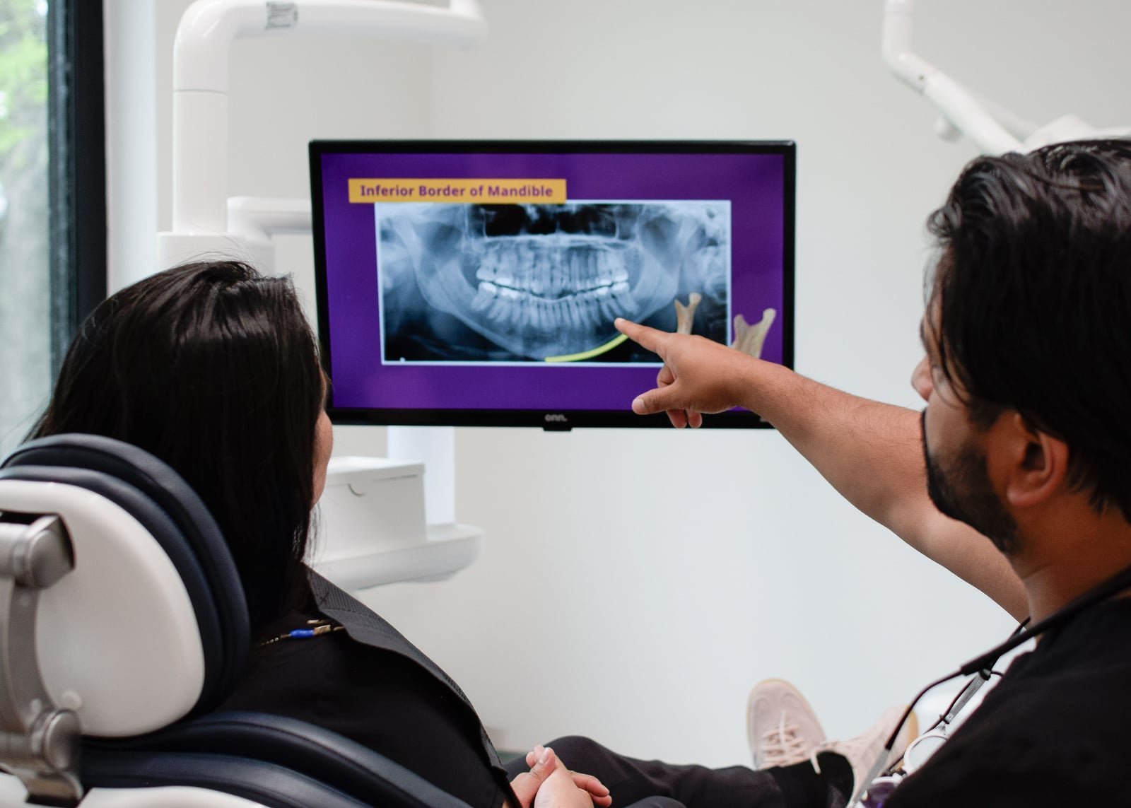 Patient education at Redwater Dental Clinic — explaining treatment options chairside