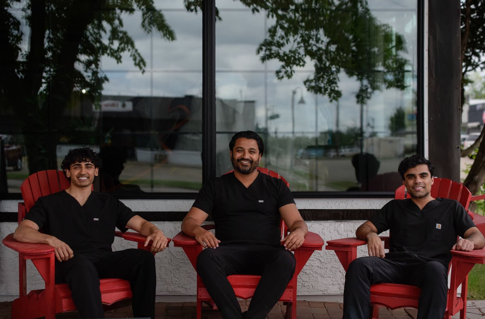 Dr. Khaleeq Panhwer with the Redwater Dental Clinic doctors outside the practice